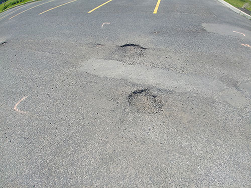 Réparation nids de poule et fissures Carignan