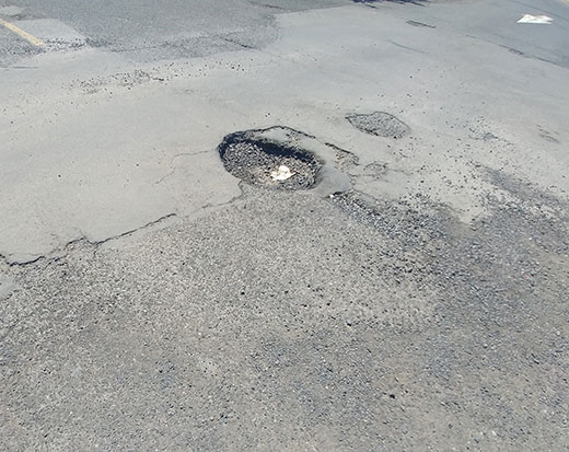 Réparation nids de poule et fissures Delson